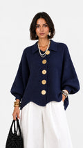 Chaqueta de punto cuello polo manga abullonada bajo ondulado